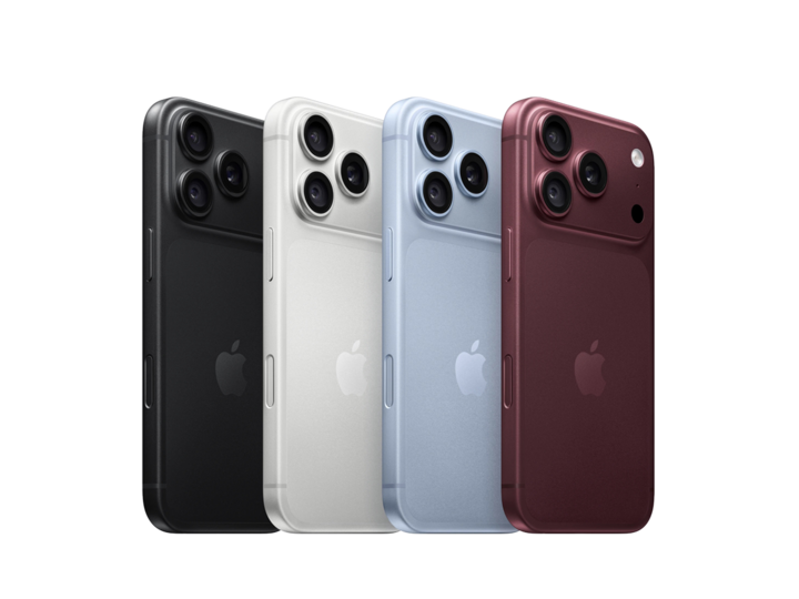 Four smartphones in black, silver, light blue, and dark red, displayed in a row.