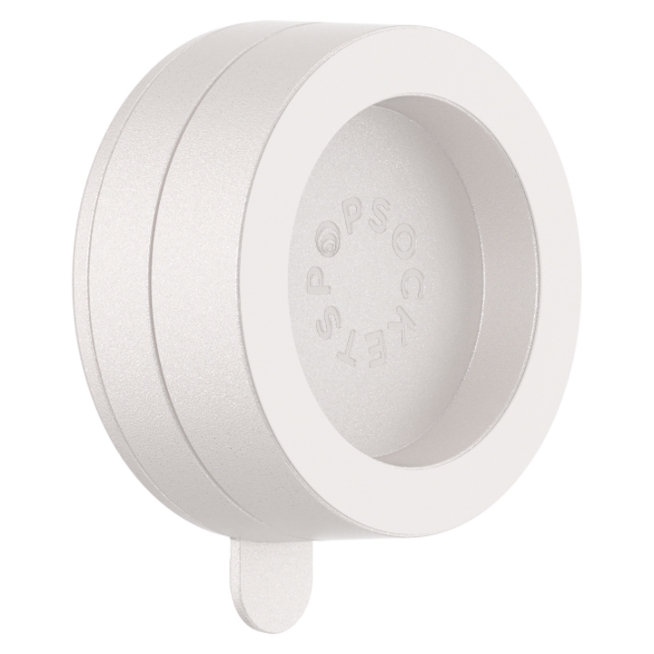 White circular phone grip with engraved text, featuring a minimalist design.